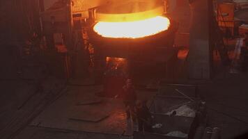 The process of pouring molten metal in a factory can be a fascinating and skillful undertaking video