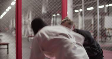 Diverse female wrestlers trying to perform takedown video