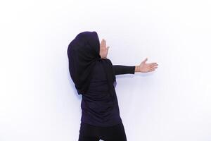 muslim woman in black hijab standing on white background photo