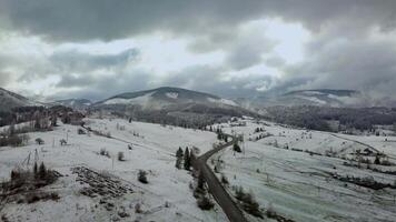 Flight over the winter landscape in the Carpathian mountains. 4K video