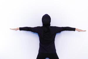 a person in a hoodie is standing with their arms outstretched photo