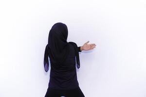a person in a black hoodie is doing a handstand photo