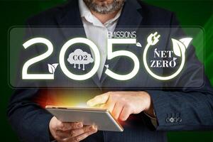 Net zero by 2050. Carbon Neutral Concepts Net Zero Emissions Goals Weather neutral long-term strategy. Net zero and carbon neutral concept photo