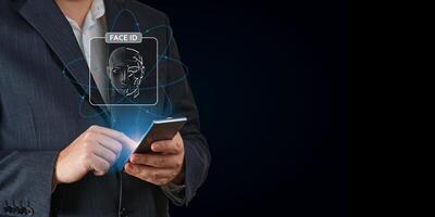 Man using mobile phone with face id scan and modern technology. Login using Face id and AI. Network security, digital banking, financial technology, online payment. Smart devices security photo
