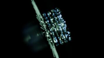 A geometric luminous sphere surrounded by platforms and lights in an abstract technological environment. loop seamless synchronized at 120 bmp video