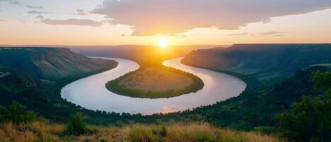 A river runs through a valley with a sunset in the background34 photo