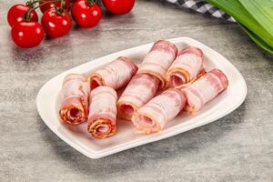 Bacon wrapped in bacon on a plate photo