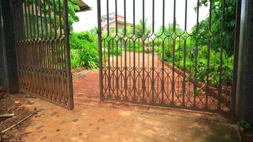 The entrance gate of the bungalow swings open video