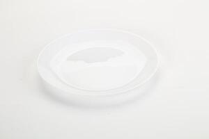 A white plate with a small hole in it photo