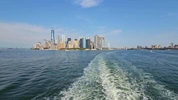 Skyline of Manhattan View from the Ferry, A panoramic view of Manhattan's skyline with iconic skyscrapers video