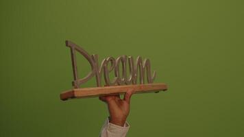 A handcrafted art object displayed on a vibrant green background enhances its appeal video