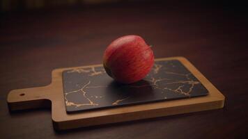 A Fresh Red Apple Artistically Displayed on an Elegant Charcuterie Board for Delightful Snacking video