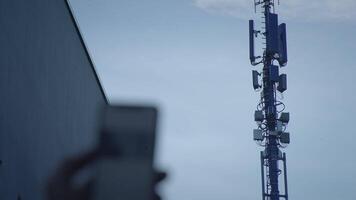 5G Communication Antenna Tower Sending Mobile Phone Data Signal Wireless Transmitting video