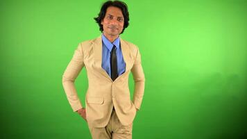 Man in blazer stands smiling looking confident video