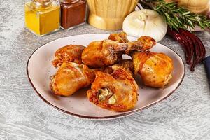 A plate of chicken wings on a table photo