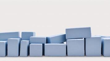 Light blue blocks arranged in a wave pattern on a white background. photo
