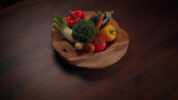 A Collection of Fresh and Colorful Vegetables Displayed on a Rustic Wooden Plate video