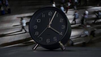 A modern clock design featuring a dynamic background with people in motion all around video