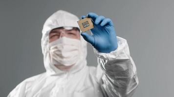 Close-up presentation of new semiconductor microchip. Technician holding piece of technological wonder. Concept of modern technology and hardware development video