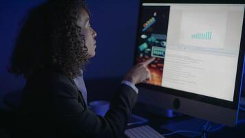 Dedicated and Focused Professional Analyzing Various Data on Computer Screen in Office video