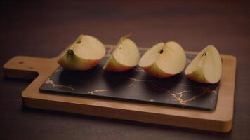 Beautifully Sliced Apples Artfully Arranged on an Elegant and Stylish Cutting Board Display video