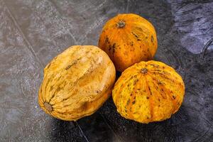 Three different types of squash on a table photo