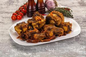 A plate of food with meat and vegetables photo