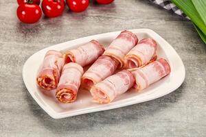 A plate with bacon wrapped in bacon on it photo