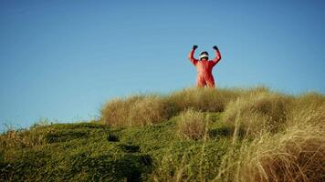 Astronaut Excited About Discovering A New Planet On Top Of Mountain video