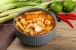 A bowl of soup with vegetables and other ingredients photo