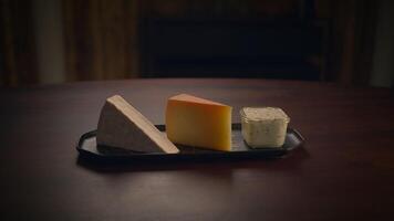 A Beautiful Artisan Cheese Selection Displayed Elegantly on a Rustic Wooden Table video