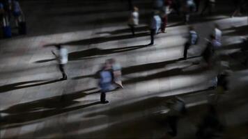 Dynamic movement of people in a busy city at night, with blurred motion creating hustle and bustle video