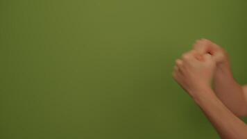 Dynamic Fists Displayed Vividly Against a Bold Green Background in an Energetic Composition video