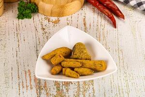 A white bowl with some food in it photo