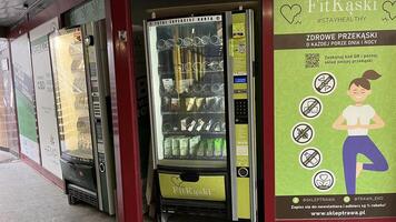 Warsaw, Poland. November 01, 2024. Two vending machines in a city setting. The machines are displaying various products. photo