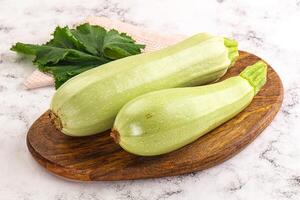 Two zucchini on a cutting board photo