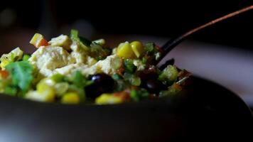 eggs with vegetables Mix of vegetables corn, carrots, peppers, broccoli, onions in teriyaki sauce on a ceramic plate on a dark concrete background video