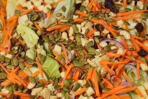 a salad with carrots, celery, and other vegetables photo