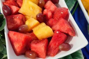 a bowl of watermelon, grapes and pineapple photo