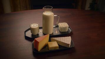 An Assortment of Various Dairy Products Beautifully Displayed on a Wooden Table Surface video