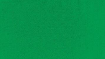 A deep green fabric with a pattern photo