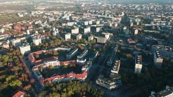 Aerial view of Wroclaw, Poland. Bird eye view of cityscape with colorful autumn trees and red roofs. City neighborhood with residential buildings and many green spaces in European city video