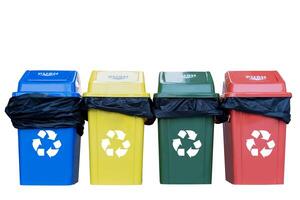 Collection of waste bins full of different types of garbage, recycling and separate waste collection photo