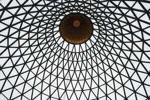 Bottom view of the iron structure of the transparent glass roof photo
