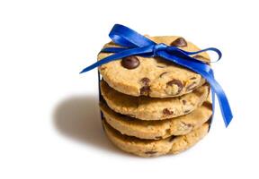 Detail of chocolate chip cookies pile isolated on white background photo