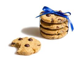 Closeup of chocolate chip cookies pile isolated on white backgro photo