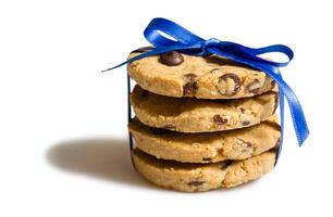 Closeup of chocolate cookies pile isolated on white background photo