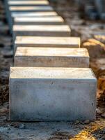 Concrete Blocks Arranged In A Row On Ground photo
