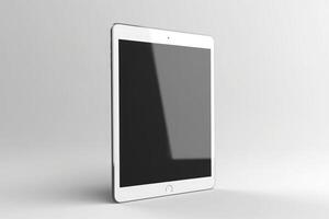 Realistic vertical white tablet device isolated on white background. Empty black screen tablet computer. photo