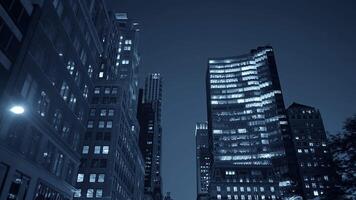 The modern urban skyline illuminated at night showcases a stunning array of buildings and lights video